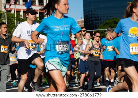Stamford, CT, USA - June 1, 2014: The individuals are some of the many runners for the cancer awarness marathon in Stamford, CT, June 1, 2014,