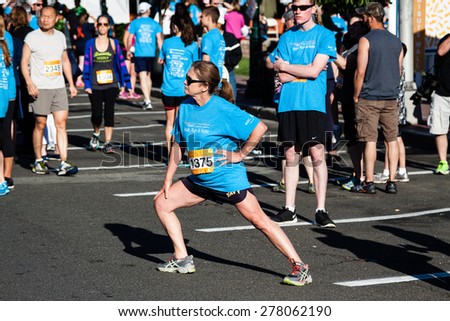 Stamford, CT, USA - June 1, 2014: The individuals are some of the many runners for the cancer awareness marathon in Stamford, CT, June 1, 2014,