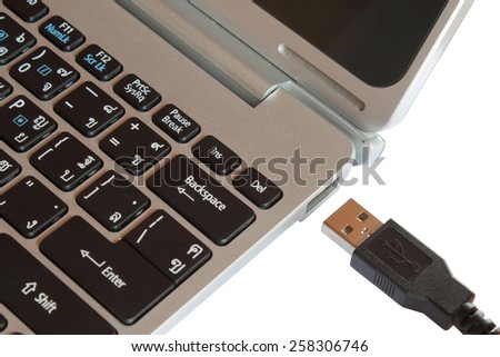 Mini laptop focus on USB port isolated on white background