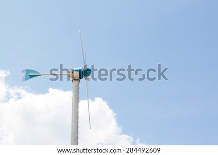 Side of Windmills for electric generator with blue sky and white