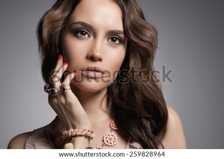Fashion studio photo of beautiful lady with jewelry.Young woman
