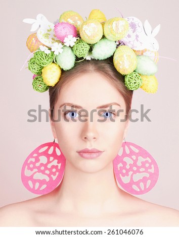 Spring Woman. Beauty model girl with colorful flowers. Easter Hair Style. Beautiful