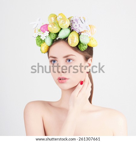 Spring Woman. Beauty model girl with colorful eggs. Holiday Easter concept