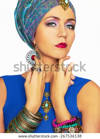 rich beautiful woman in turban and jewelry.fashionable Elegant Lady.Indian queen