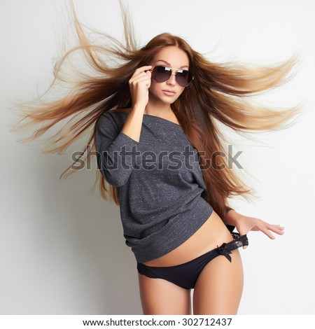 beautiful sexy girl in underwear and sunglasses. beauty woman. flying healthy hair