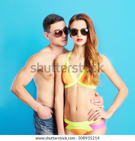 fashion beautiful couple in sunglasses.beauty woman and handsome man.boy and girl in bikini together