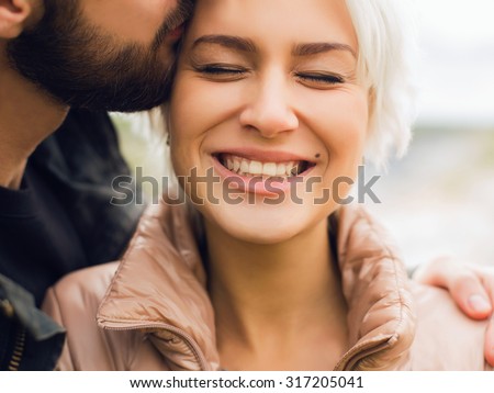 Lovely happy couple.romantic beautiful woman and handsome man.bearded boy and blond girl outdoor together