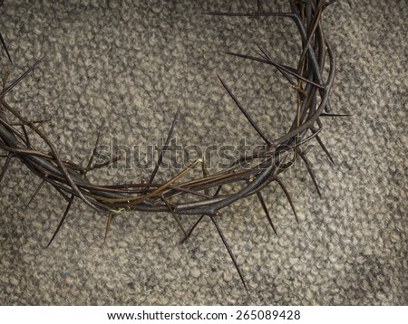 Crown of thorns on burlap background