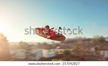 Flying guy on a giant biscuit