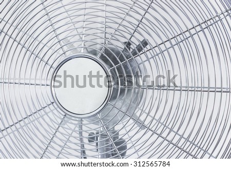air cooler chrome Metal fan on a white background with spinning blades during summer period.