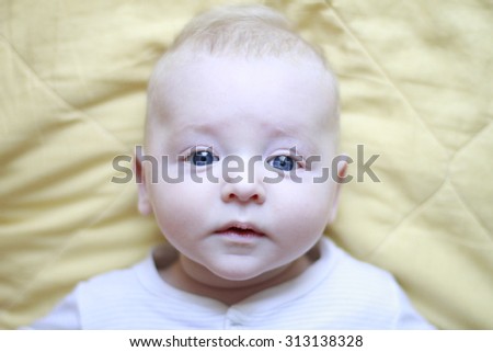 small child looking surprised eyes of the world