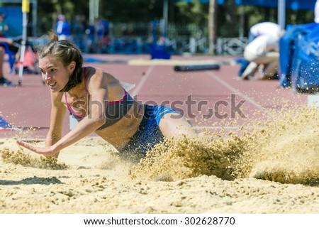 long jump girls with spray sand