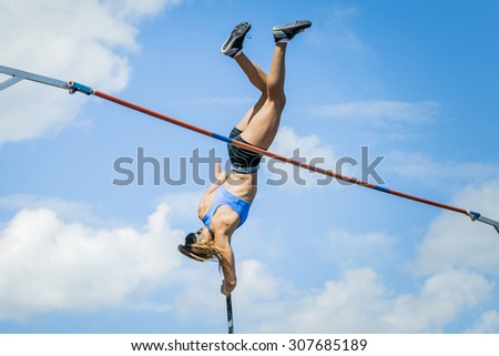 Chelyabinsk, Russia - July 24, 2015:  Girl athlete competing in the pole vault  during National competitions in memory of G. I. Nicewhen athletics, Chelyabinsk, Russia - July 24, 2015