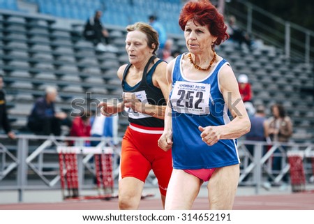 Chelyabinsk, Russia - August 28, 2015:  70 years old women run 100 meters during championship of Russia on track and field athletics among the elderly, Chelyabinsk, Russia - August 28, 2015
