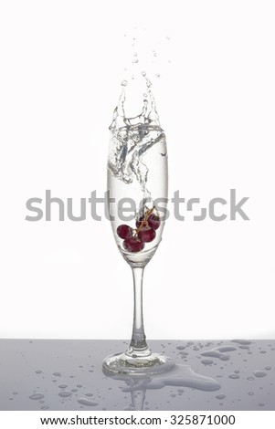 Grapes in a glass isolated, Soda splashes in the glass isolated