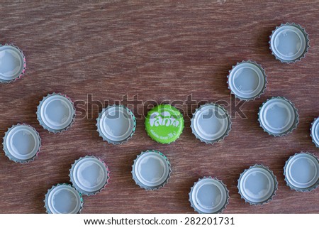 Friday, 29 May 2015: in Chiang Mai Thailand ,Fanta Bottle Caps on wood table.