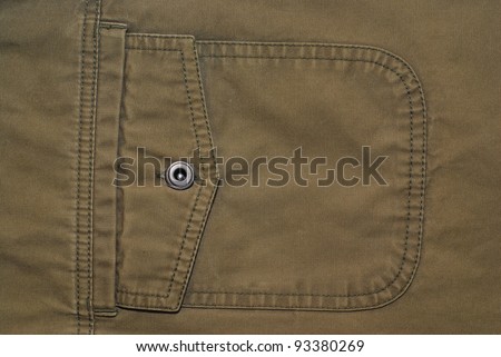 Khaki brown shirt flap patch-pocket closeup with the button and prominent textile texture