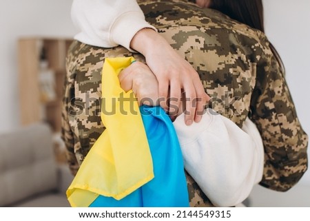 Similar – Image, Stock Photo Girl hugging military man after homecoming