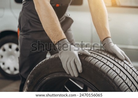 Similar – Image, Stock Photo Bearded mechanic repairing wheel of bicycle