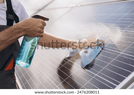 Similar – Image, Stock Photo Man cleaning solar panel on roof. Solar panel or photovoltaic module maintenance. Sustainable resource and renewable energy for go green concept.  Solar power for green energy. Technology for future.