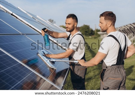 Similar – Image, Stock Photo Man cleaning solar panel on roof. Solar panel or photovoltaic module maintenance. Sustainable resource and renewable energy for go green concept.  Solar power for green energy. Technology for future.