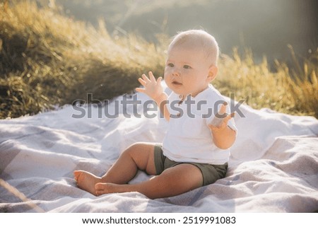 Similar – Image, Stock Photo Young baby sitting in high chair looking towards window; interior of home with vintage furniture