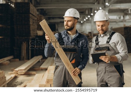 Similar – Image, Stock Photo Skilled woodworker using milling machine while working with lumber in contemporary workroom