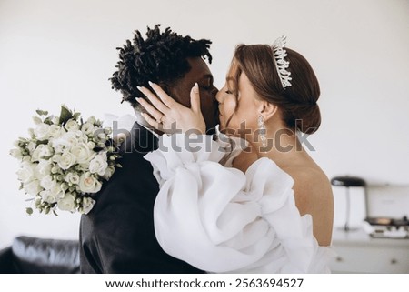 Similar – Image, Stock Photo Newlywed couple kissing during romantic travel