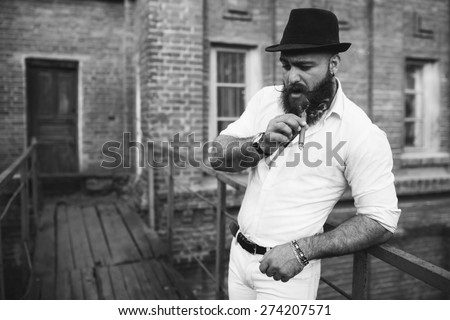 bearded italian boss smoke the cigar, black and white