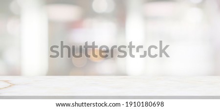 marble table top with blurred abstract cafe restaurant interior background