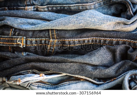 fashionable clothes, pile of jeans