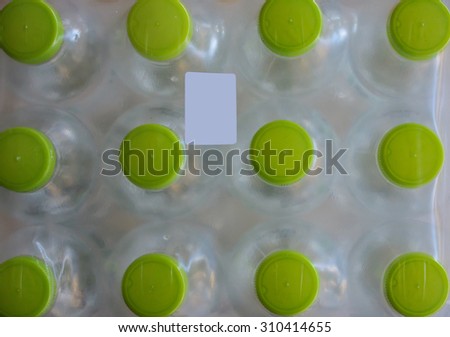 water bottles in plastic pack with sticker label, top view