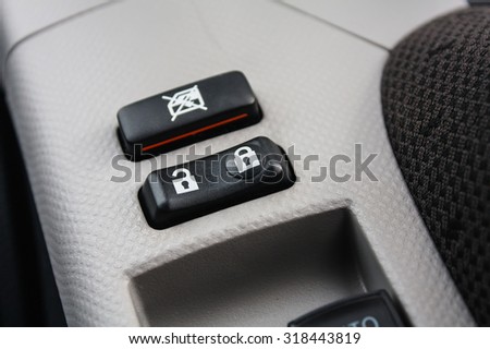 Car Door Lock Button Closeup. Electric Locking Button in Modern Car