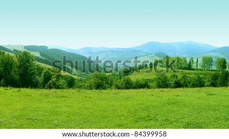 Mountains Landscape with Grass Meadow on Foreground