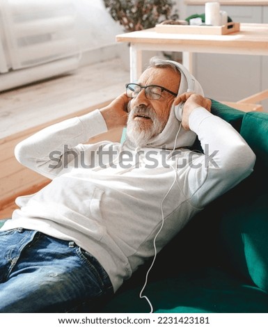 Similar – Image, Stock Photo Senior man using medical device to measure blood pressure