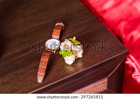 Luxury watch, chronograph closeup, beautifull white boutonniere