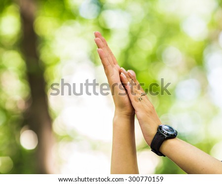a happy woman clapping hands, two hands