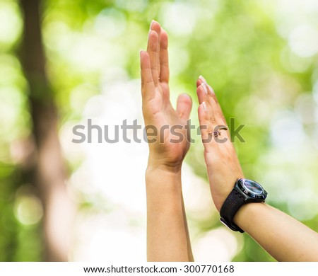 a happy woman clapping hands, two hands