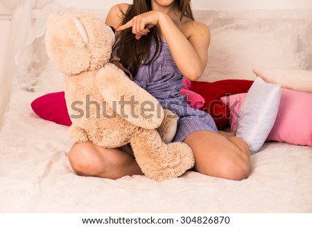 beautiful young girl with big teddy bear