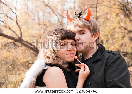 Portrait of angel and devil. Halloween day