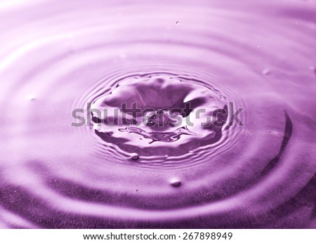 Water splash in purple color