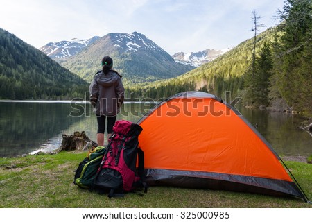 Camp in the mountains near of the lake. Bivouac on the lake in the Alps