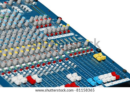 analog audio mixing board isolated in selective focus. Sliders with several channels and push buttons.