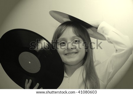 little girl with vinyl disk