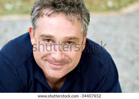 middle aged man looking at camera