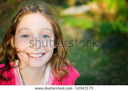 close up of a tween girl outdoors on a nice spring evening