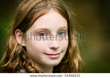 pretty tween girl looking at the camera