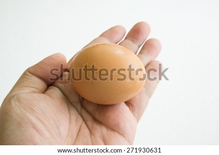 egg hand hold one human thumb index