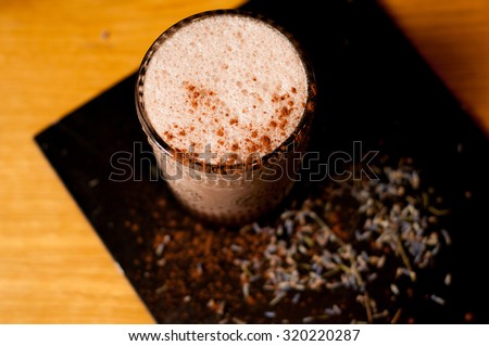 lavender hot cocoa drink on concrete background cool shadows natural light background