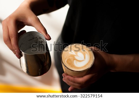 cool trendy barista girl with tattoos making cappuccino cool shadows natural light background
